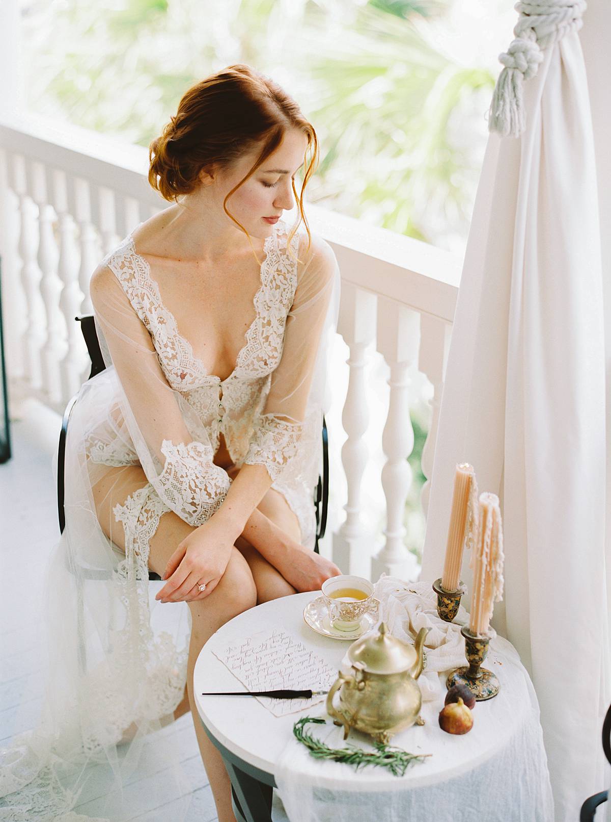 charleston wedding bridal boudoir morning getting ready at 86 cannon street on film with bride in lingerie writing love letter