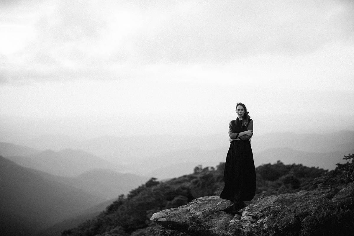 bride on top of mountain destination north carolina adventure elopement black and white 35mm film and black dress
