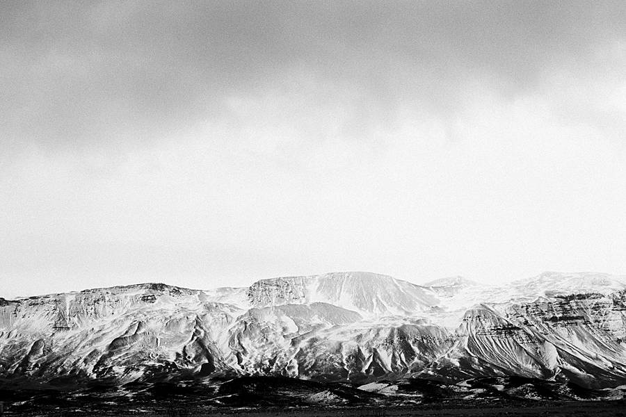 snow covered iceland mountain on grainy black and white kodak tri-x 400 35mm film pushed 2 stops at 1600