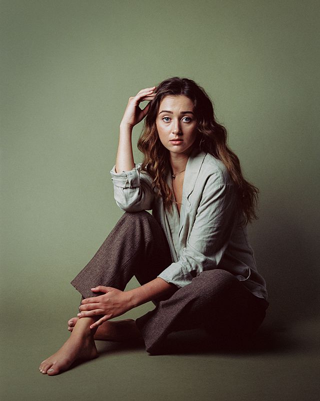 film portrait of girl in olive clothing and olive seamless backdrop shot on kodak portra 160vc film in charlestons sc photography studio studio sixty reid