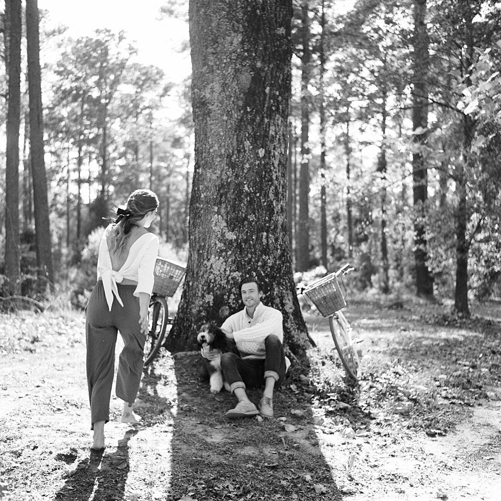 wedding couple with dog on black and white film at south carolina wedding venue wavering place by brian d smith photography