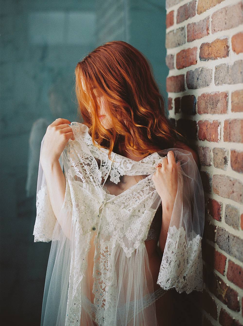 charleston sc boudoir with girl in lingerie holding lace robe on kodak portra 800 film by boudoir photographer brian d smith photography