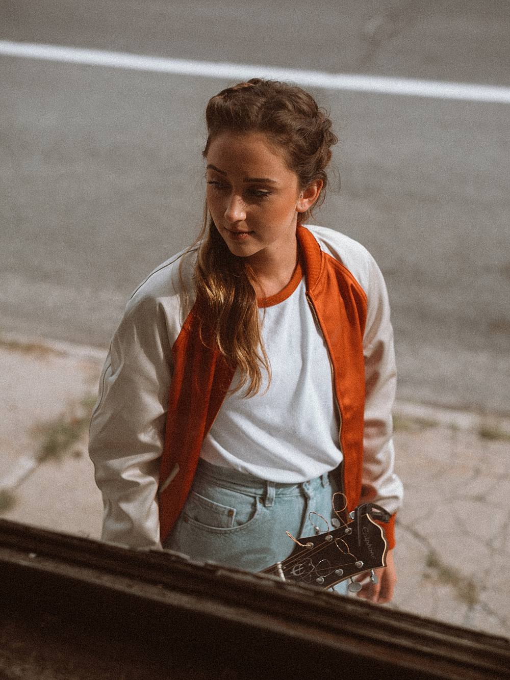 levis vintage clothing and fashion inspired advertisement editorial in northern michigan with girl looking through window by brian d smith photography