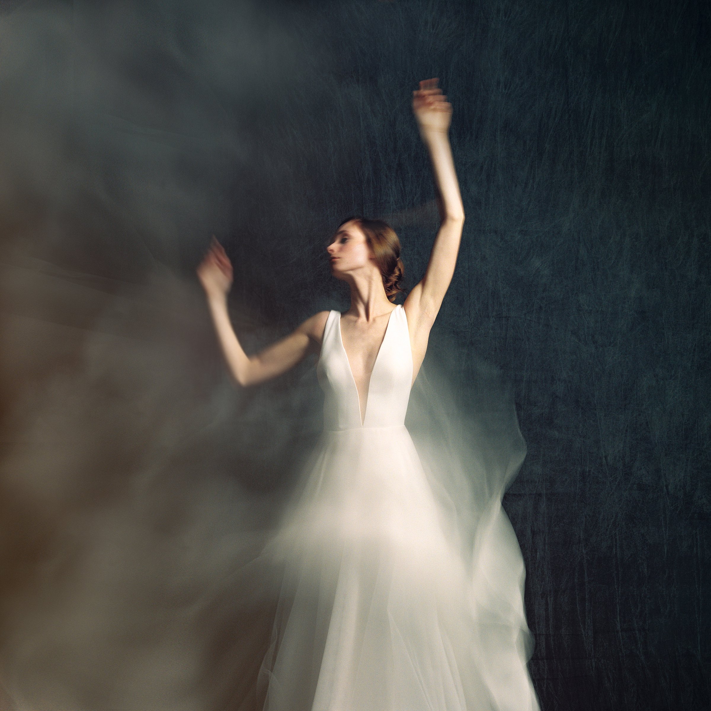 movement on film using a hasselblad 202fa and kodak portra 800 film with a bride in wedding dress in studio