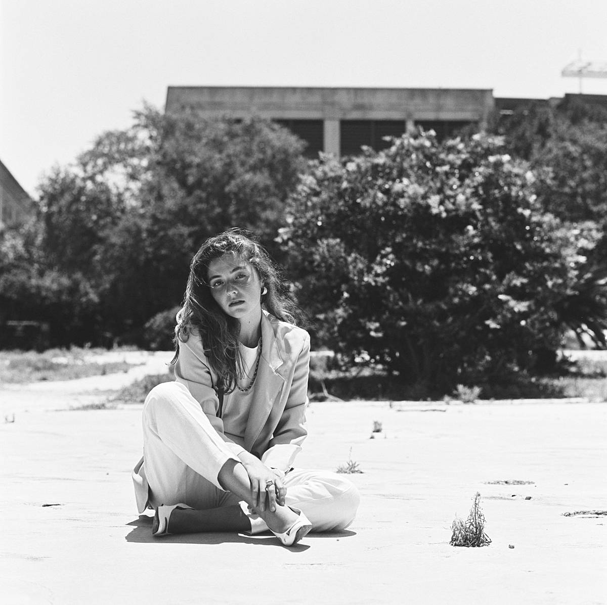 black and white film fashion portrait of girl in womens blazer and linen pants in charleston sc editorial feature