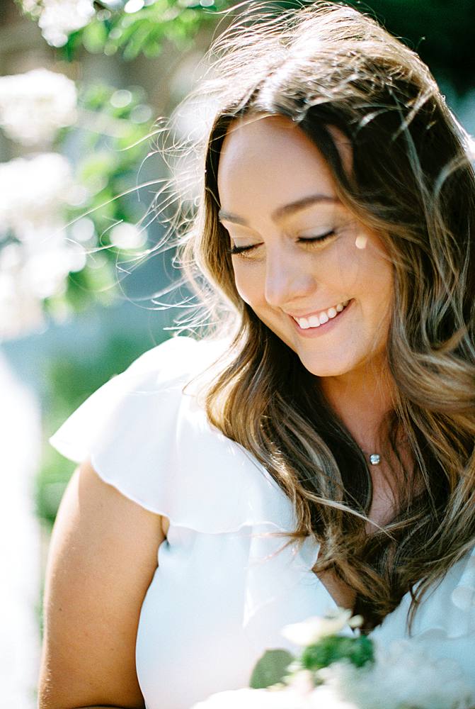 dreamy portrait of a charleston sc bride in front of hotel bennett on 35mm kodak portra 400 film shot with canon eos 1v