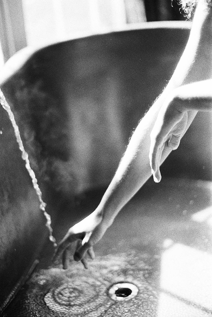black and white boudoir asheville north carolina hand in bathtub grainy kodak p3200 35mm film