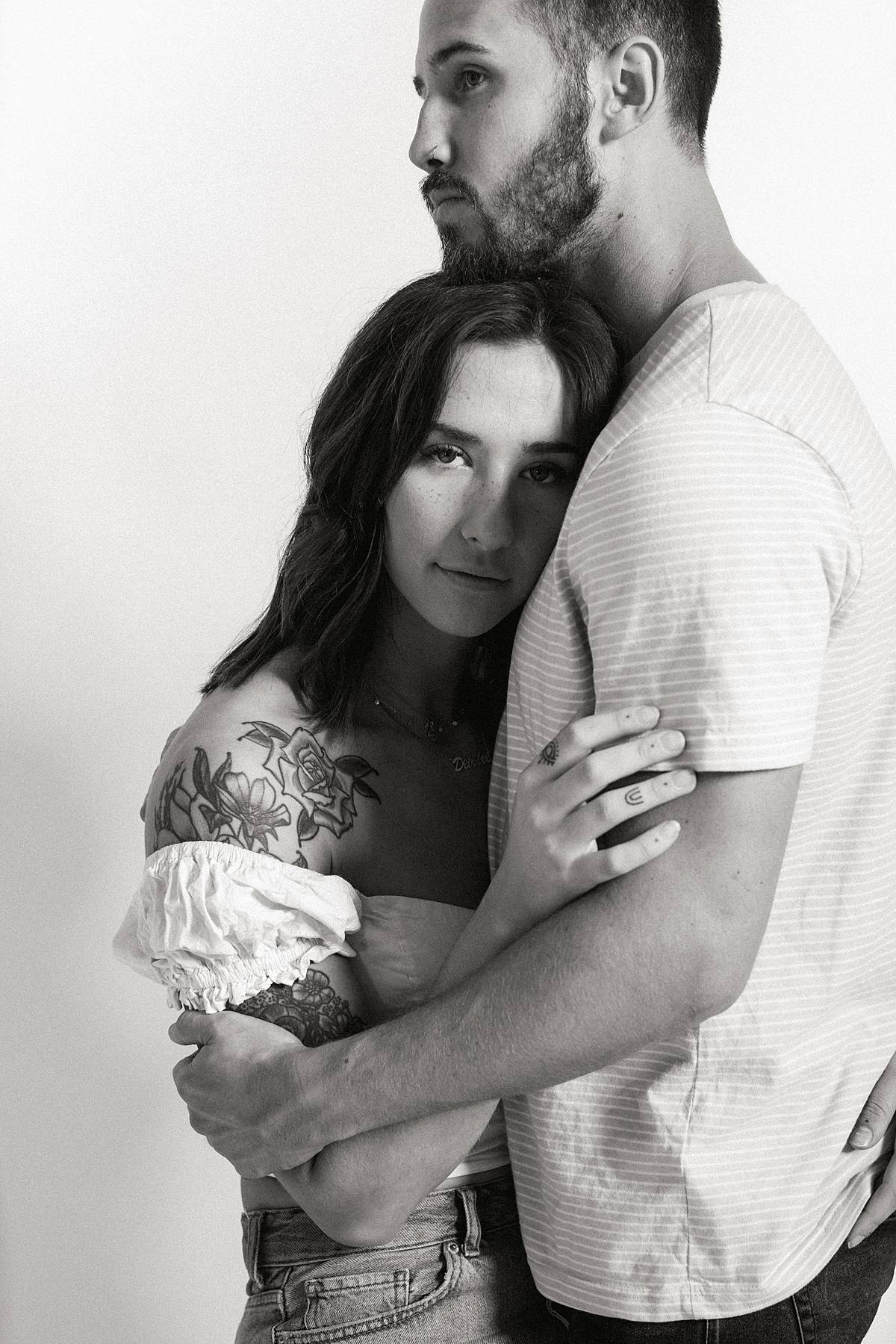 Premium Photo | Portrait of a beautiful young couple in love, posing in a  studio, dressed in classic clothes