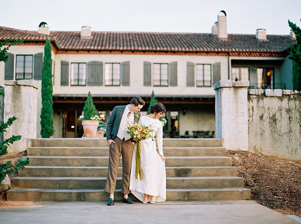 hotel domestique bride and groom in vintage wedding dress and suit during south carolina wedding elopement featuring old world italian design