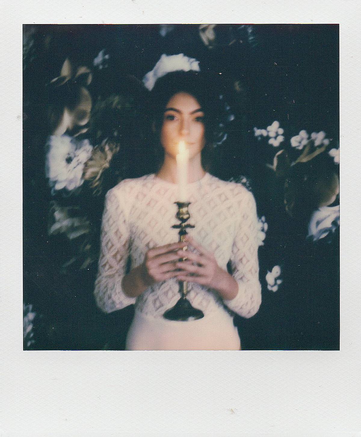 bride on polaroid during charleston south carolina bridal boudoir photography session