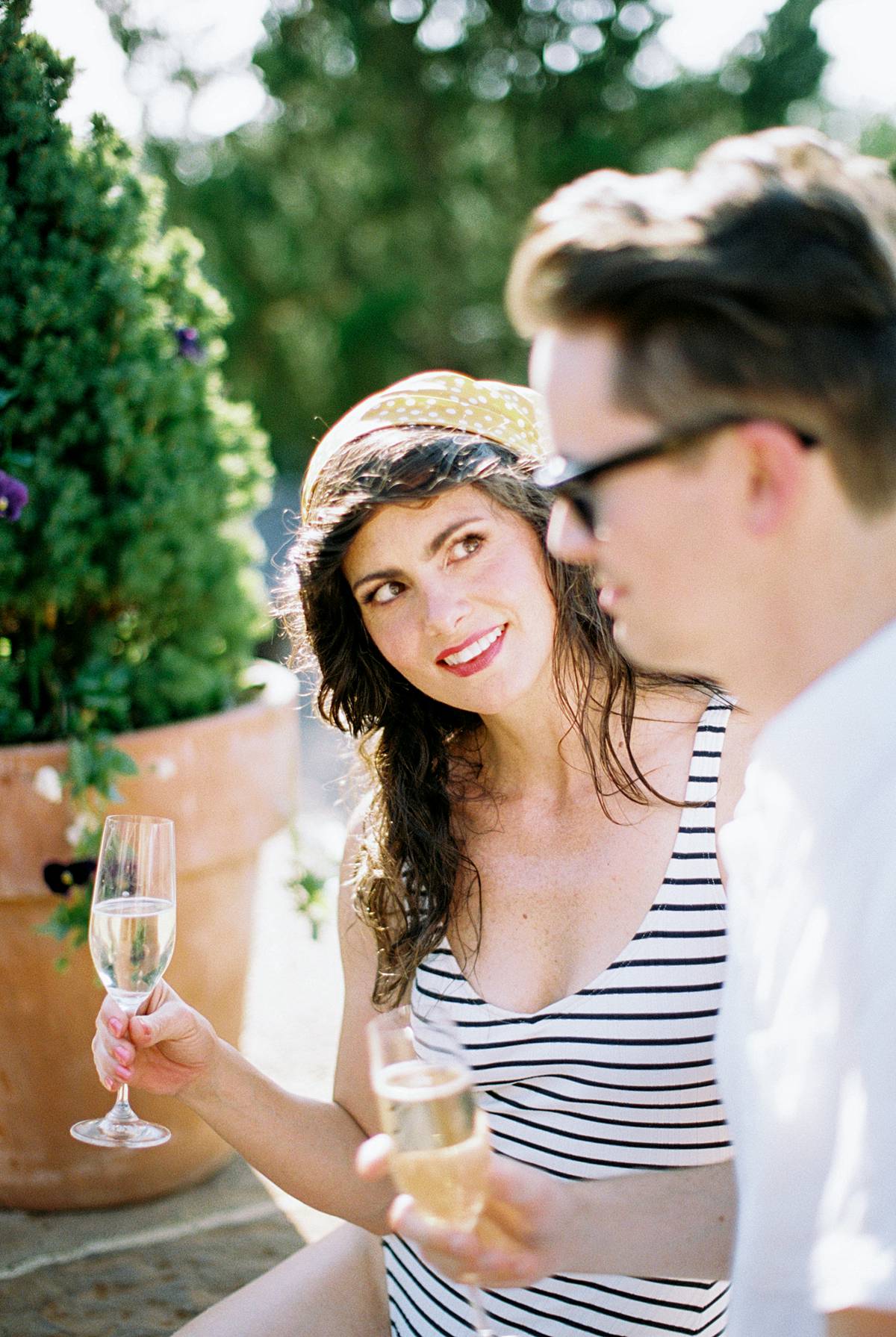elopement photograph with couple enjoying champagne by pool during getaway micro wedding at hotel domestique near greenville south carolina