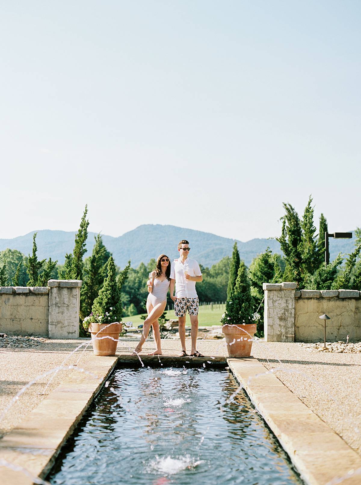 weekend elopement with couple hanging out by pool at hotel domestique south carolina during micro wedding