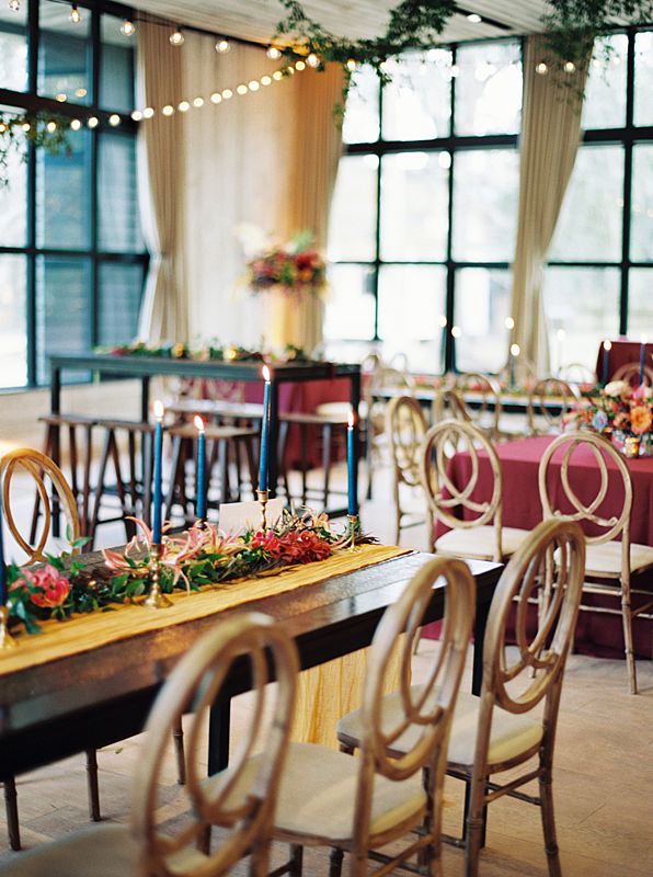 jewel tone tablescape at charleston sc wedding venue middleton place during reception