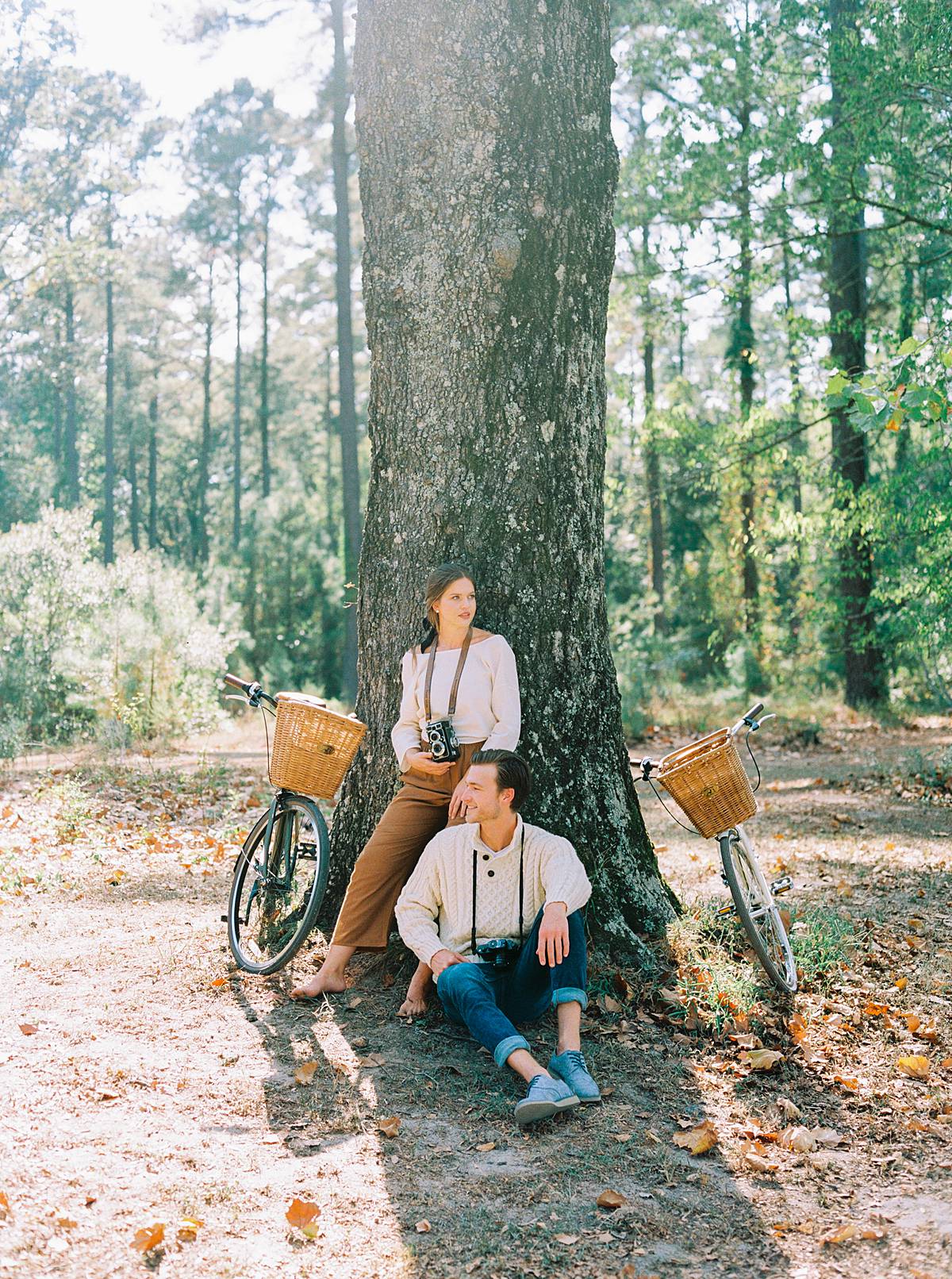 south carolina fall engagement fashion for proposal engagement at wavering place with dog and vintage bikes