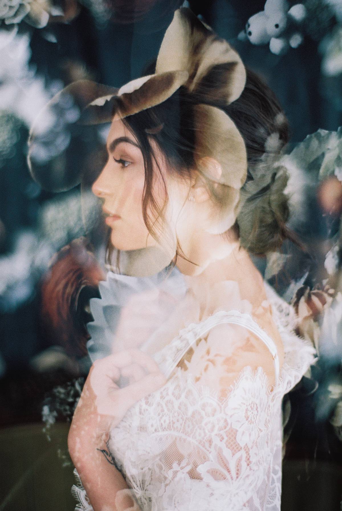 bridal boudoir double exposure on 35mm film with bride in lace robe lingerie and floral backdrop in charleston