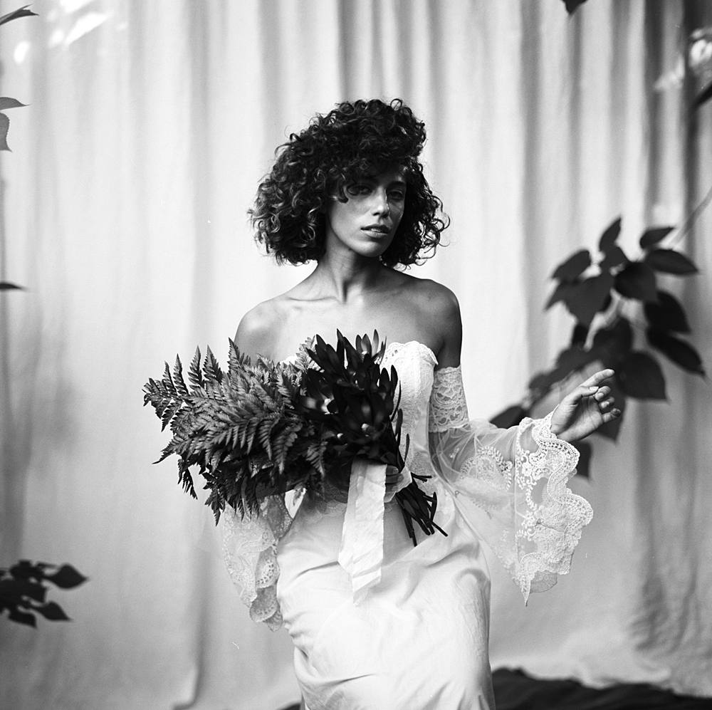 kodak t-max 400 black and white 120 film portrait of charleston bride in outdoor portrait studio in victorian wedding dress