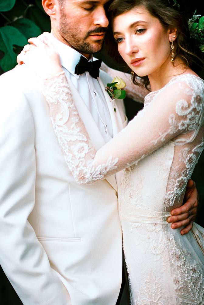 close up 35mm film portrait of charleston sc bride and groom in outdoor portrait studio sixty reid